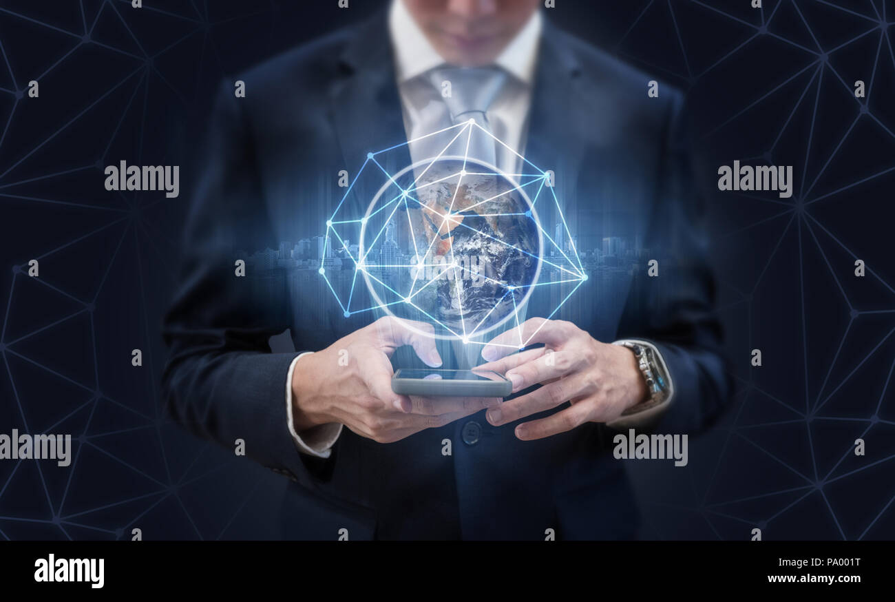 Businessman using mobile phone and global network technology. Element of this image are furnished by NASA Stock Photo