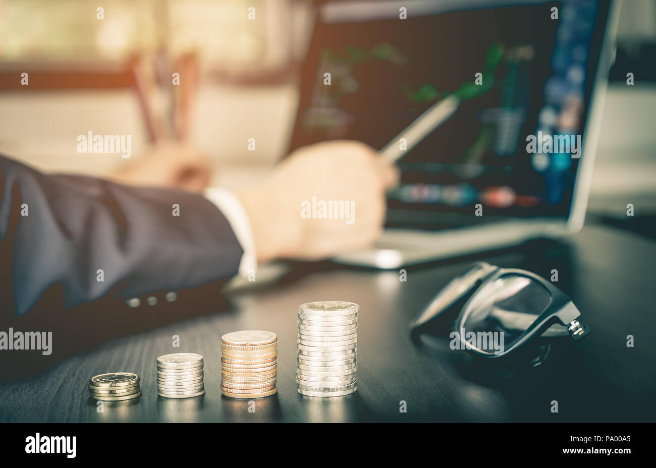 Stock Broker is analyzing stock on his computer screen Stock Photo Alamy