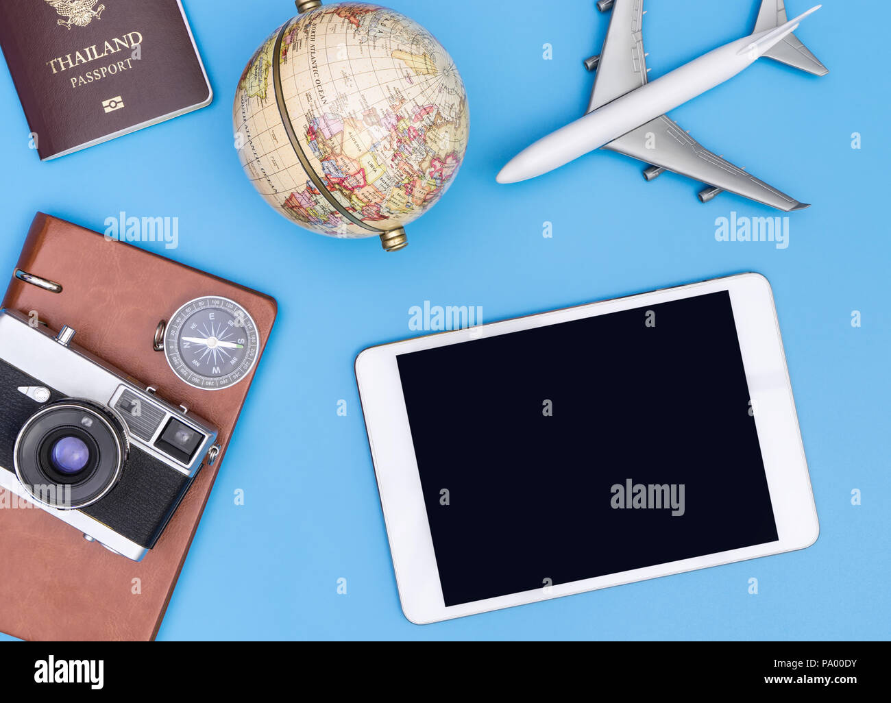 Blank tablet screen mock up with retro  travel objects Stock Photo