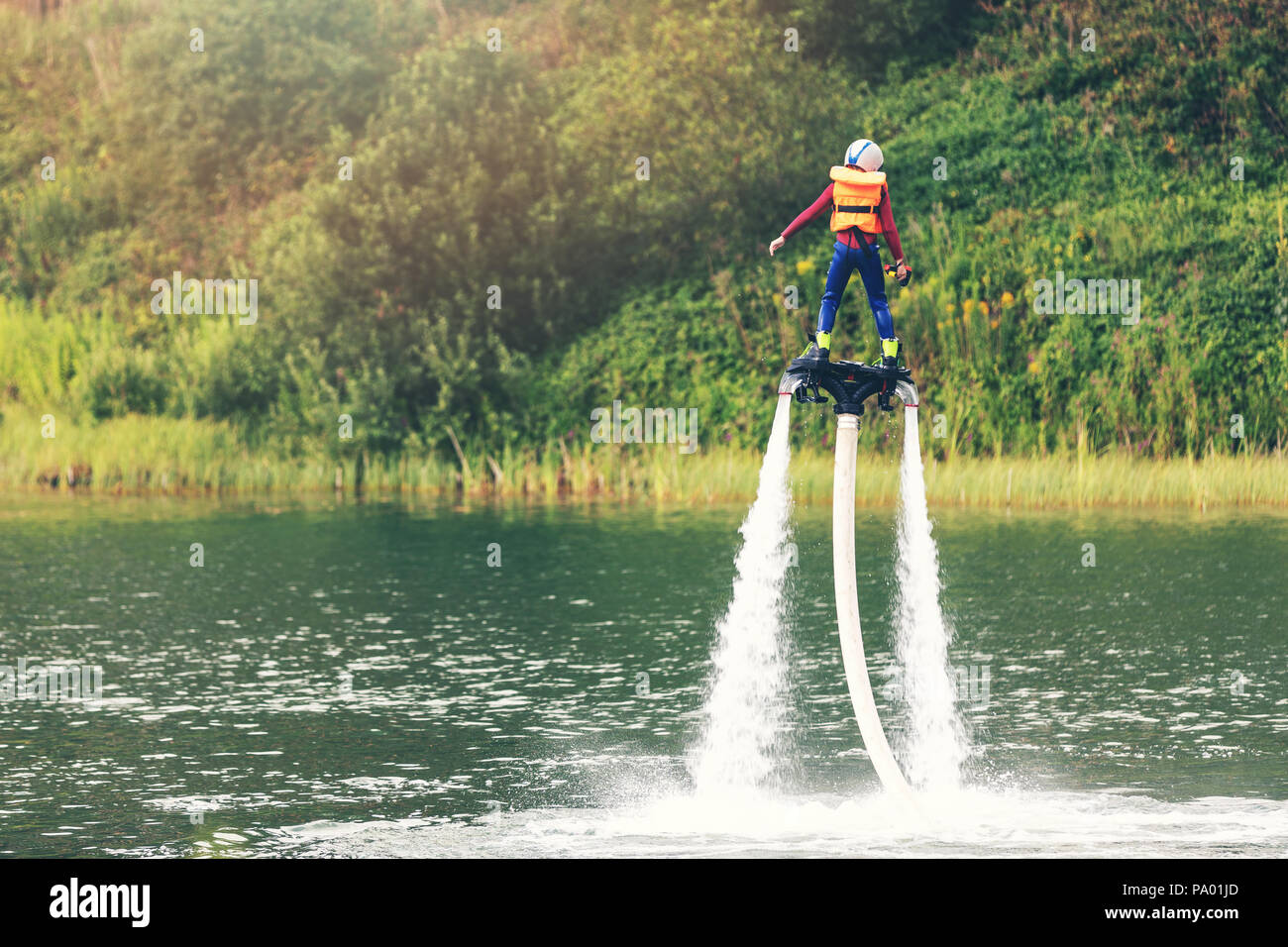 child on flyboard hover in the air Stock Photo