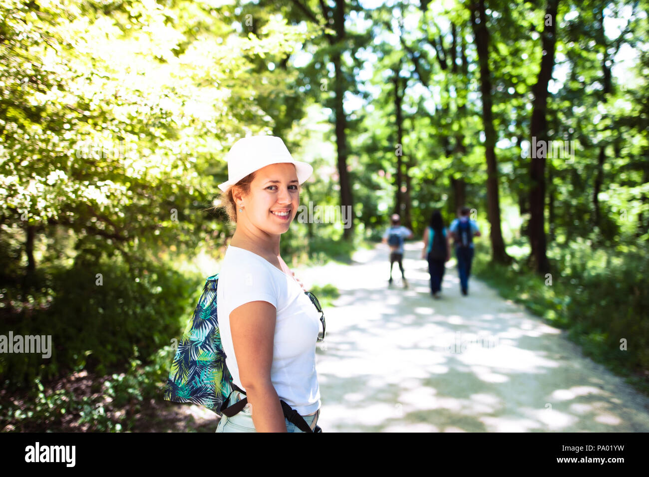 Woman hiking through wood hi-res stock photography and images - Alamy