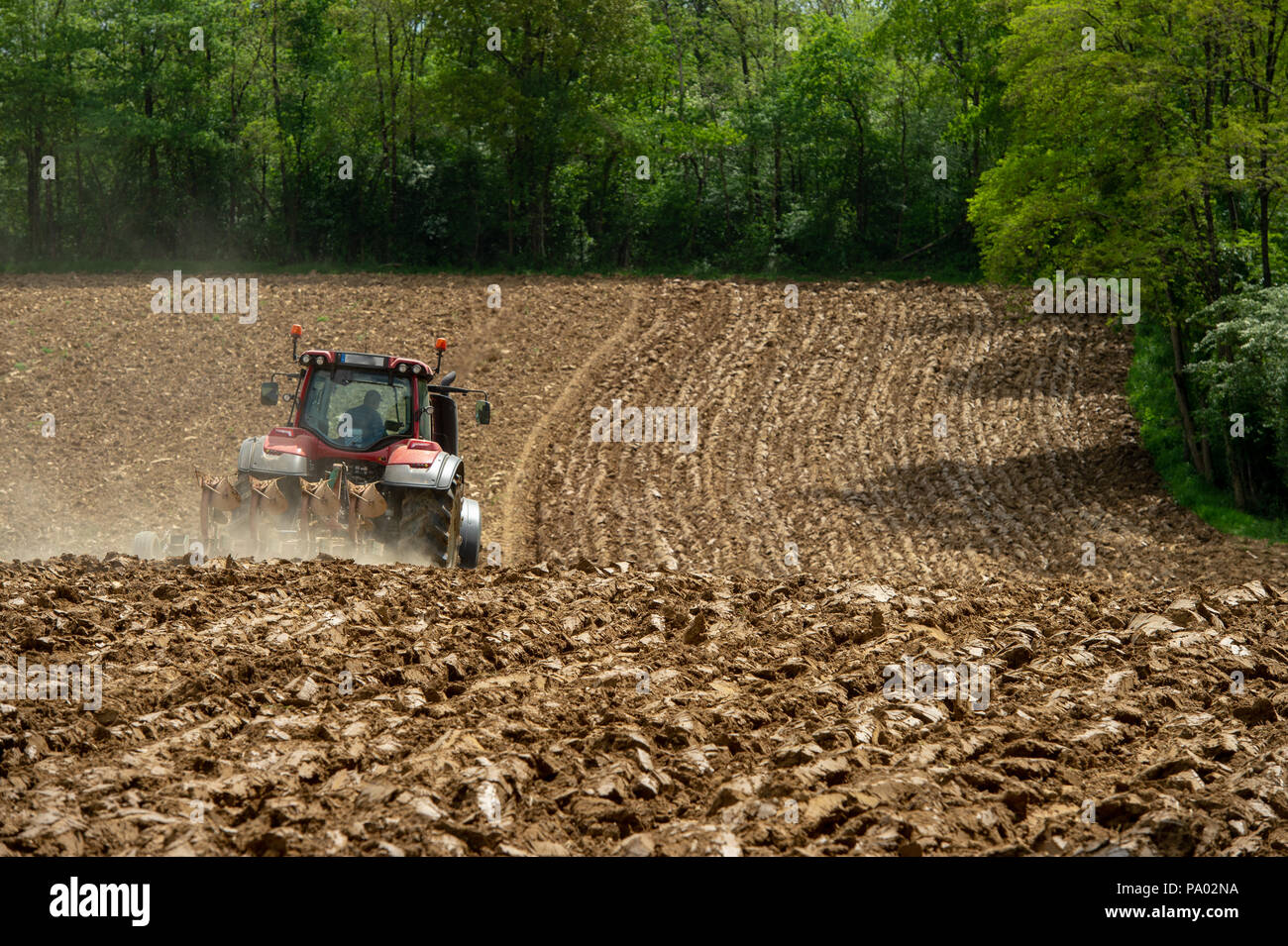 Farmer on tractor plow field, France, Europe Stock Photo - Alamy