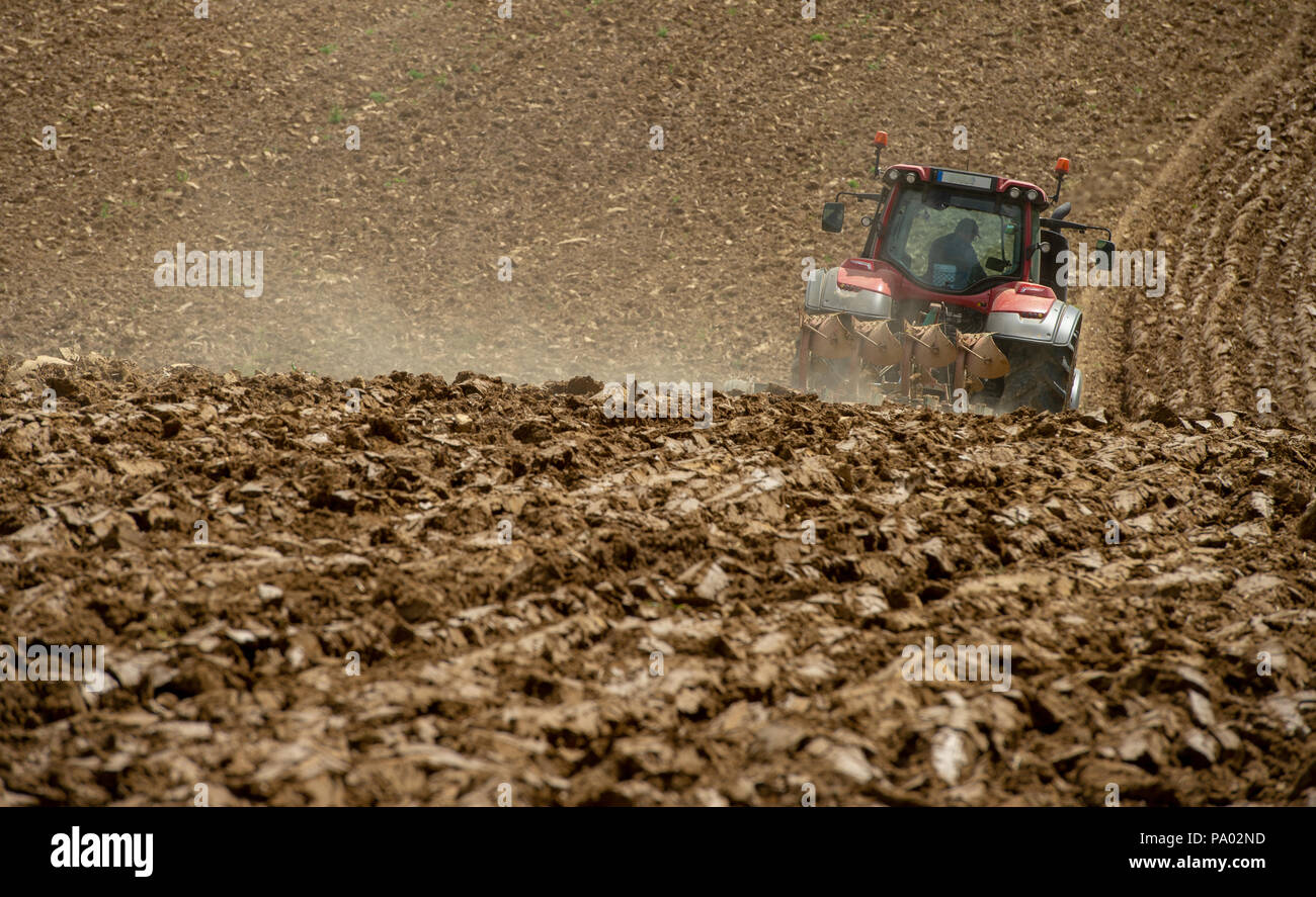 Farmer on tractor plow field, France, Europe Stock Photo - Alamy