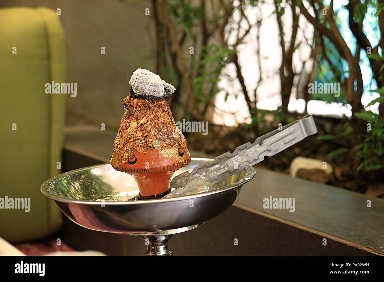 Ajami tobacco leaves burning in a hookah head Stock Photo Alamy