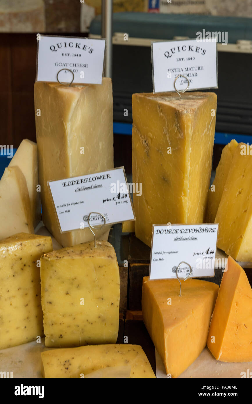 cheese on sale at a market stall. cheddar and mature cheddar Stock Photo Alamy