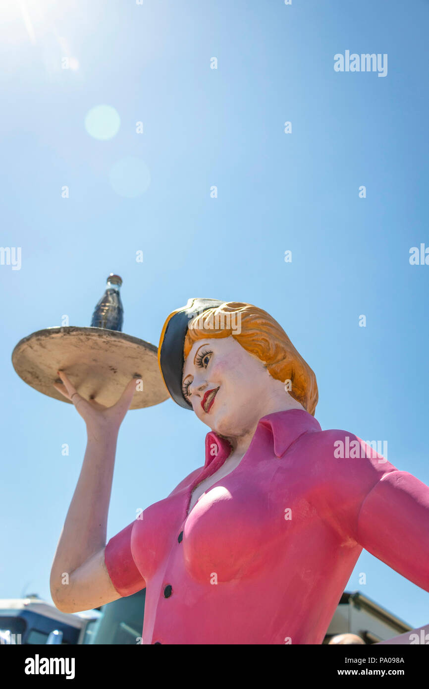 vintage mannequin of female fast food barhop server on roller skates at with coke on a tray at Stars & Stripes classic American car show Stock Photo