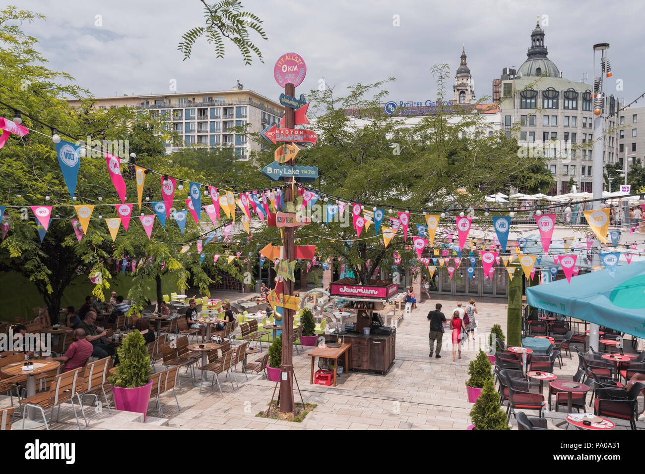 People enjoying summer outdoor markets and restaurants in central