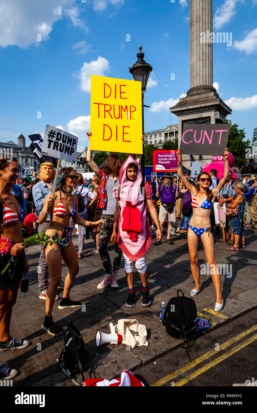Anti Trump Protestors Holding Up Crude Signs, Tragalgar Square, London, England Stock Photo