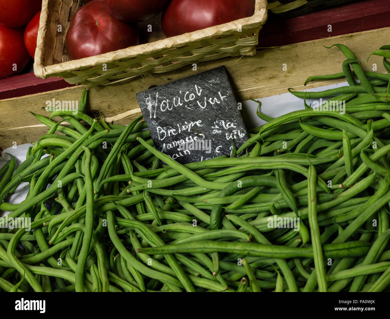 Haricots Verts loose organic French Green Beans vegetables rustic charming display with traditional slate chalk information label, hand picked in local Brittany vegetable farm Bretagne France Stock Photo