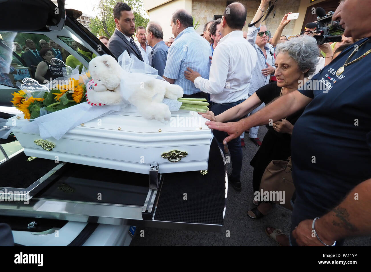 Rossano, Italy. 19th July, 2018. Rossano, the funeral of Stanislao Acri, a 35-year-old lawyer, his wife Daria Stella Olivo, aged 35, and their little 6-month-old Pier Antonio Acri, who died on 15 July in a terrible accident on the A1 near Frosinone. They were coming back from Rome on board their Fiat Punto and were hit by a van. Stanislao Acri had been nominated for mayor of Rossano for the Movimento 5 Stelle.19/07/2018, Rossano, Italy Credit: Independent Photo Agency Srl/Alamy Live News Stock Photo