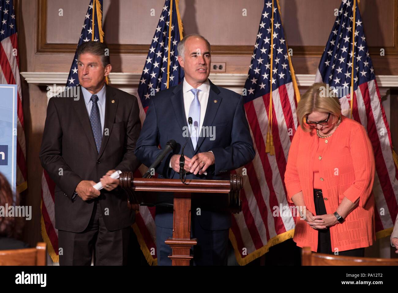 Washington DC, USA. 19th July, 2018. U.S. Senator Bob Casey of Pennsylvania, joined by fellow democrats, calls for protecting pre-existing conditions in health insurance policies during a news conference on Capitol Hill July 19, 2018 in Washington, D.C. Standing from left to right are: Sen. Joe Manchin, Sen. Bob Casey, and Sen. Claire McCaskill. Credit: Planetpix/Alamy Live News Stock Photo