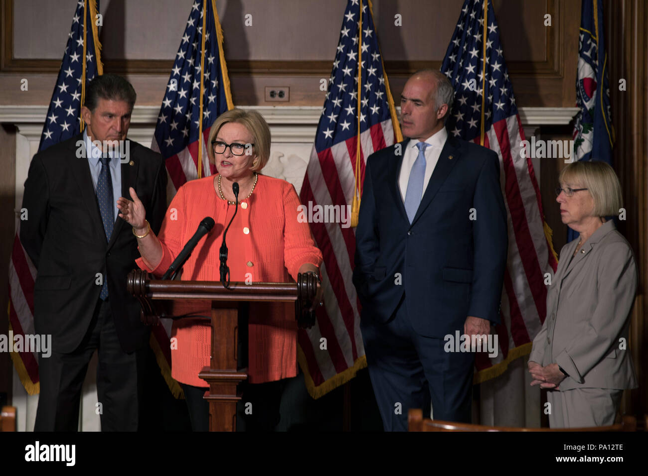 Washington DC, USA. 19th July, 2018. U.S. Senator Claire McCaskill of Missouri, joined by fellow democrats, calls for protecting pre-existing conditions in health insurance policies during a news conference on Capitol Hill July 19, 2018 in Washington, D.C. Standing from left to right are: Sen. Joe Manchin, Sen. Claire McCaskill, Sen. Bob Casey, and Sen. Patty Murray. Credit: Planetpix/Alamy Live News Stock Photo