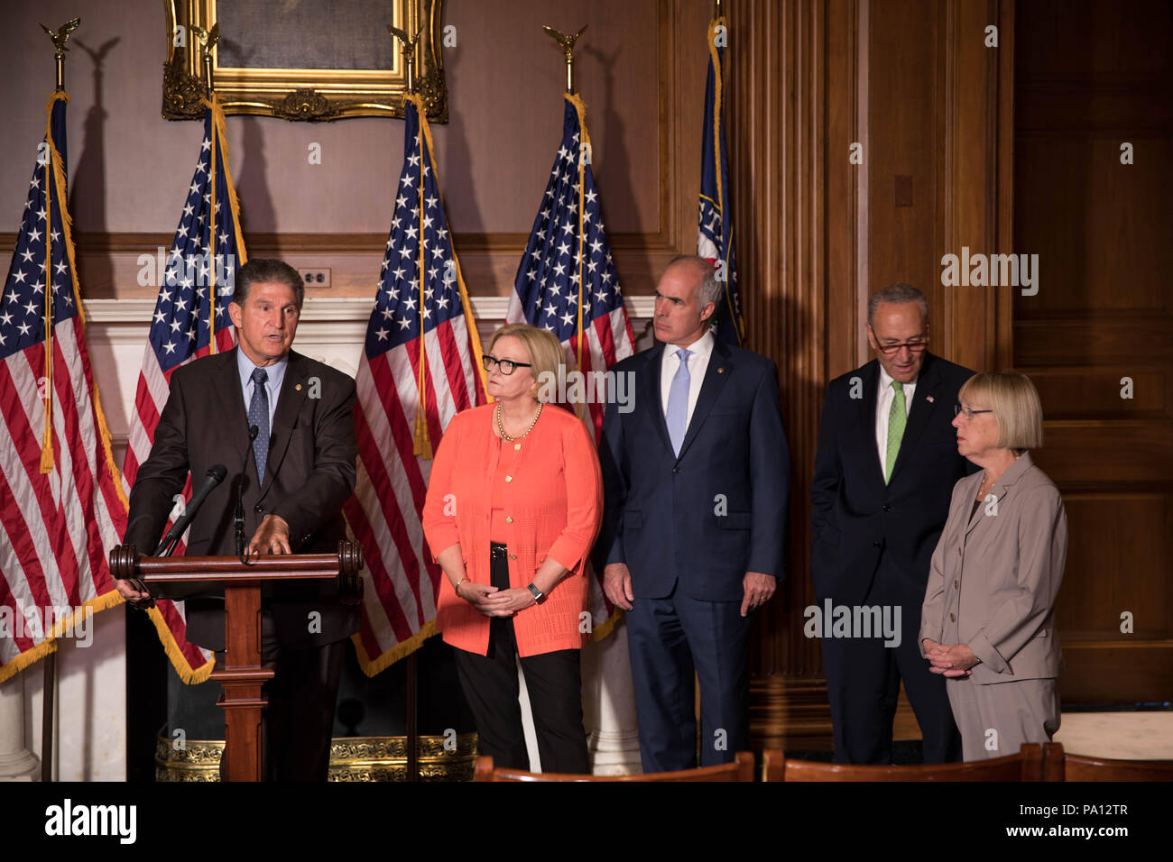 Washington DC, USA. 19th July, 2018. U.S. Senator Joe Manchin of West Virginia, joined by fellow democrats, calls for protecting pre-existing conditions in health insurance policies during a news conference on Capitol Hill July 19, 2018 in Washington, D.C. Standing from left to right are: Sen. Joe Manchin, Sen. Claire McCaskill, Sen. Bob Casey, Minority Leader Chuck Schumer and Sen. Patty Murray. Credit: Planetpix/Alamy Live News Stock Photo