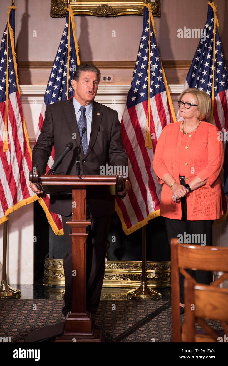 Washington DC, USA. 19th July, 2018. U.S. Senator Joe Manchin of West Virginia, joined by Sen. Claire McCaskill, calls for protecting pre-existing conditions in health insurance policies during a news conference on Capitol Hill July 19, 2018 in Washington, D.C. Credit: Planetpix/Alamy Live News Stock Photo