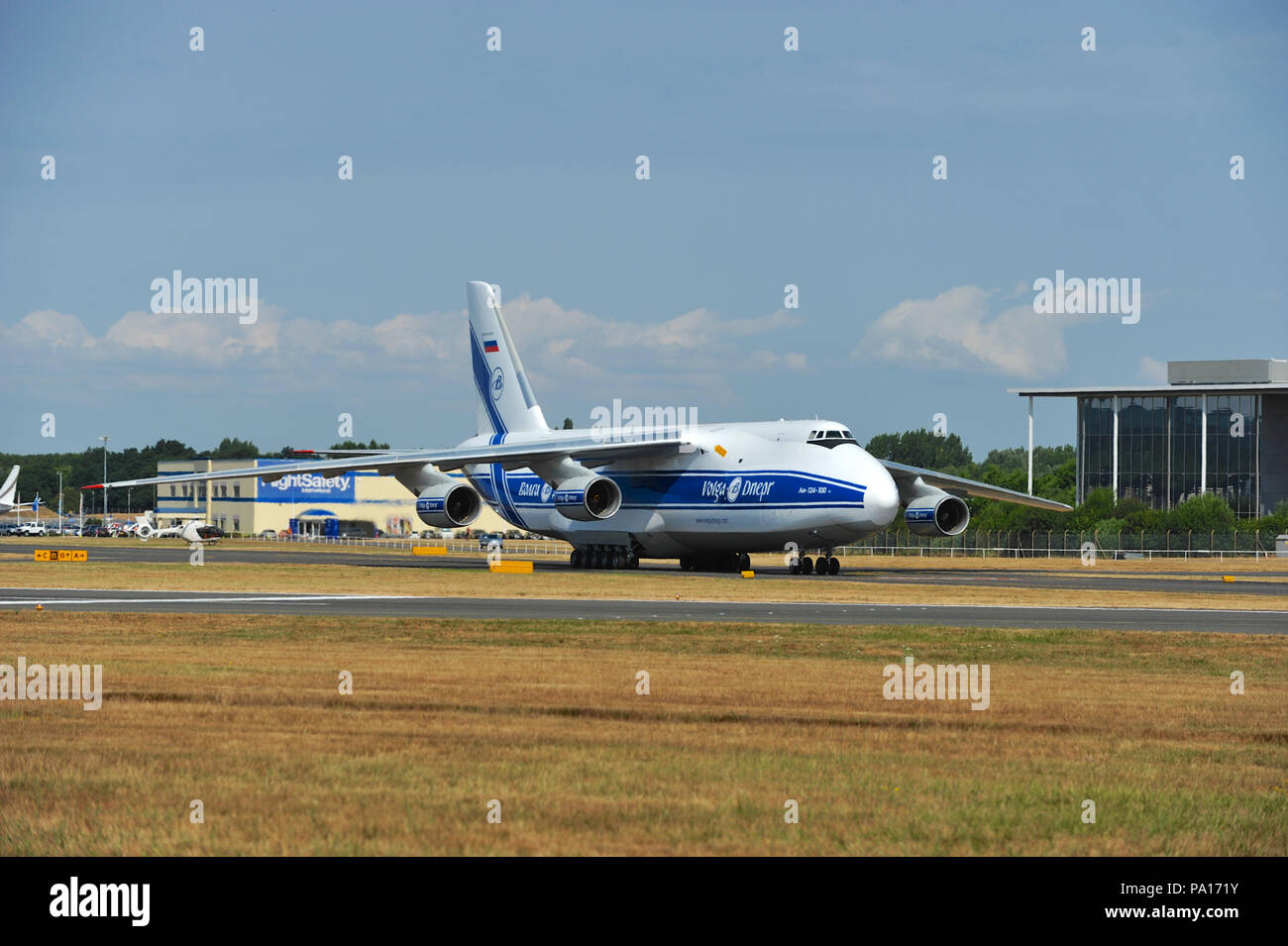 Farnborough, Hampshire, UK. 19th July, 2018. An Antonov An-124 strategic airlift jet aircraft taking off on day four of the Farnborough International Airshow (FIA) which is taking place in Farnborough, Hampshire, UK.  The air show, a biannual showcase for the aviation industry, is the biggest of it's kind and attracts civil and military buyers from all over the world. trade visitors are normally in excess of 100,000 people. The trade side of the show runs until July 20 and is followed by a weekend of air displays aimed at the general public.   Credit: Michael Preston/Alamy Live News Stock Photo