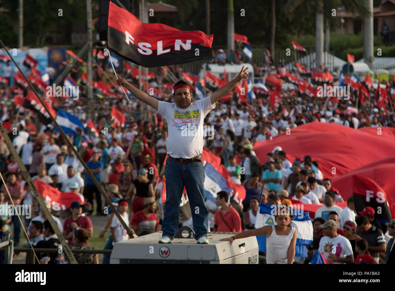 Managua, Nicaragua. 19th July, 2018. A supporter of the Sandinista National Liberation Front (FSLN) taking part in an event in conmemoration of the 39th anniversary of the Sandinista revolution. The Nicaraguan president has accused the country's Catholic church of being part of an attempted coup against his government. According to Ortega, the country's Catholic bishops aren't intermediaries in the political crisis, but rather part of a putschist conspiracy. Credit: Carlos Herrera/dpa | usage worldwide/dpa/Alamy Live News Stock Photo