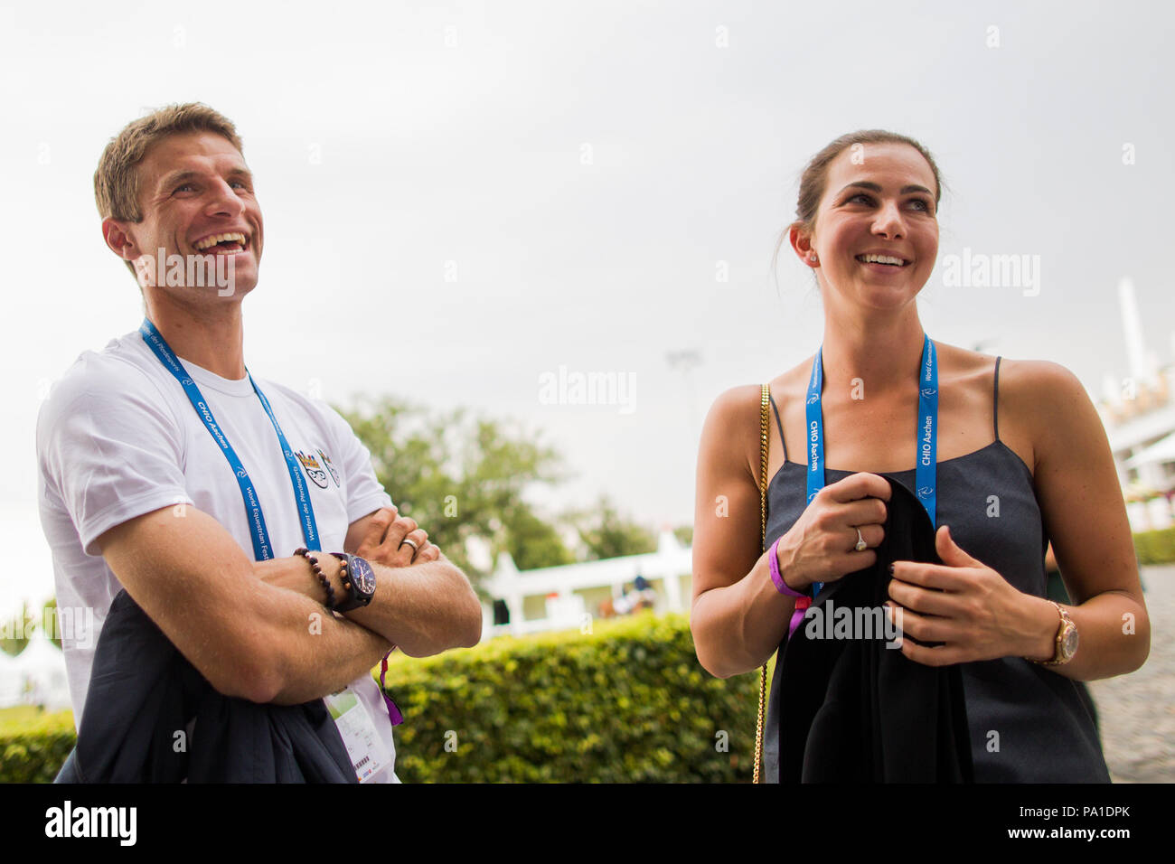 20 July 2018, Germany, Aachen, CHIO, Equestrian Sports, North-Rhine Palatinate Prize: German national soccer player Thomas Mueller (L) and his wife conversing during the event. Photo: Rolf Vennenbernd/dpa Stock Photo