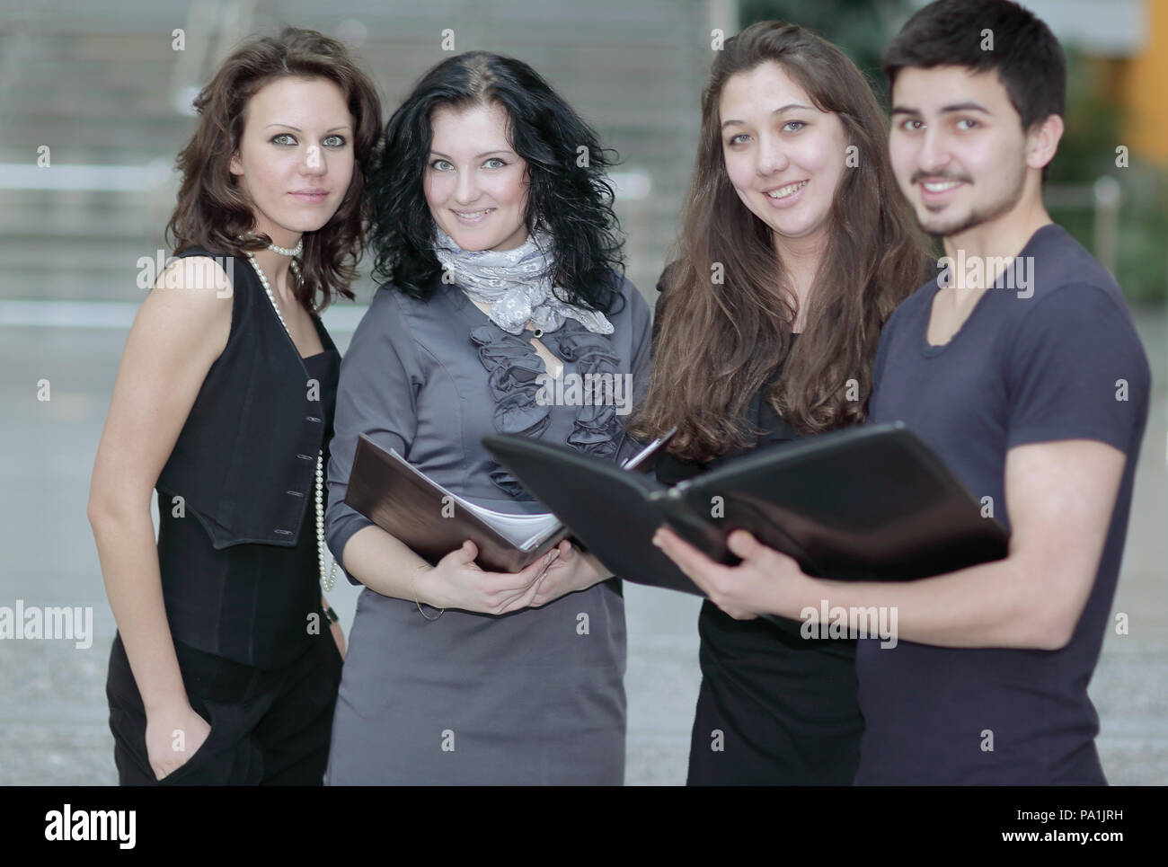 creative business team standing near office building Stock Photo - Alamy