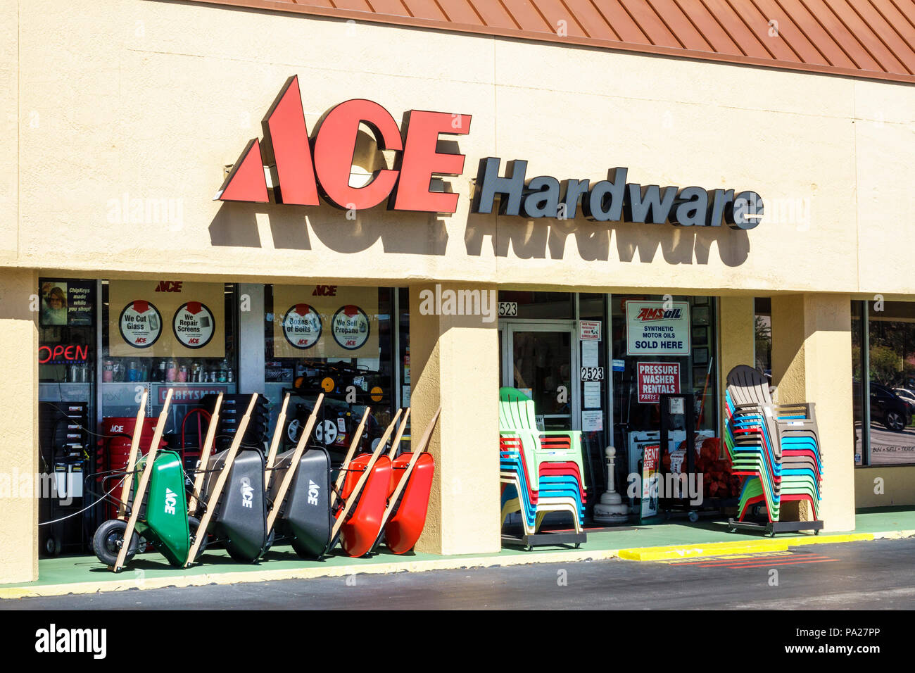 Orlando Florida,Ace Hardware,store exterior front entrance,signage,wheelbarrows,outdoor chairs,FL171029084 Stock Photo