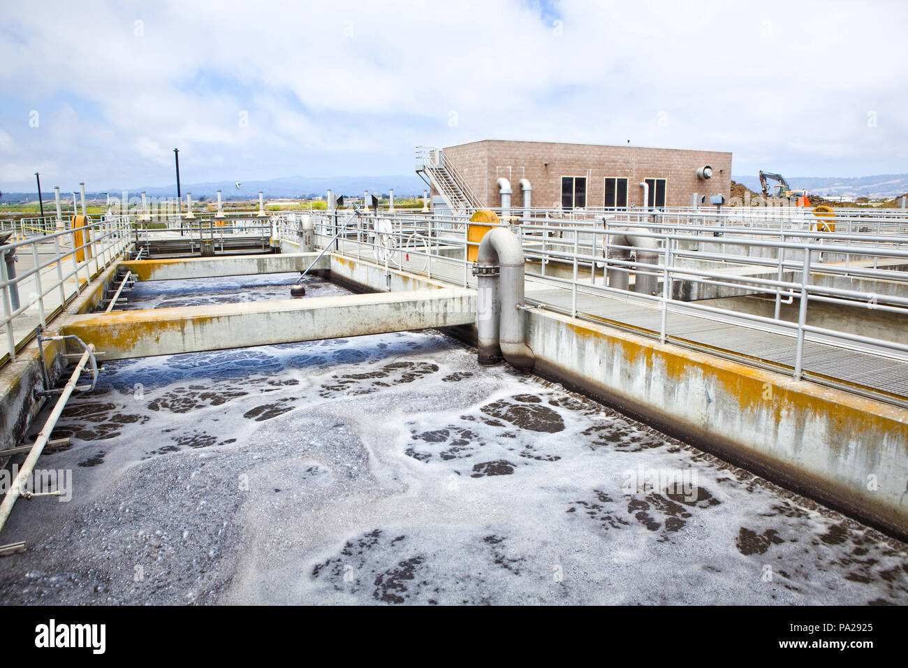 Aeration stage at a wastewater treatment plant, active bubbling to the water's surface Stock Photo