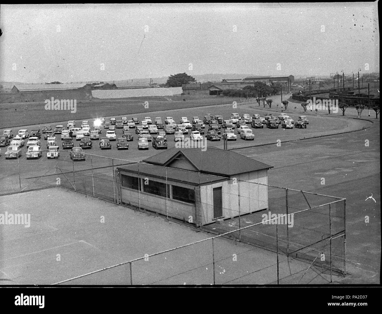 258 SLNSW 33575 Cars parked at BHP during bus strike Stock Photo