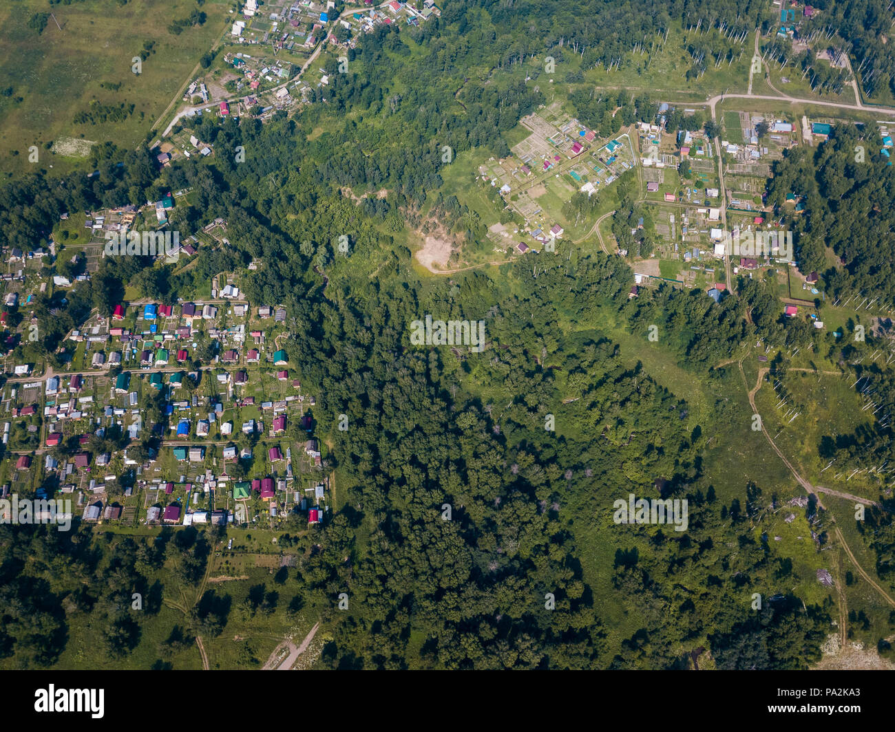 Helicopter drone shot. View from above on a small village, motor road ...