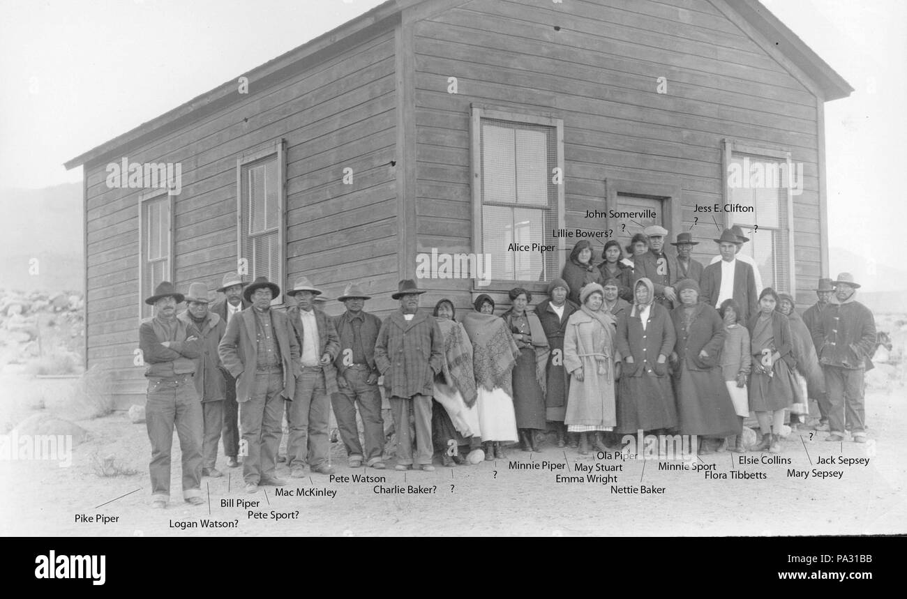 . English: Local Big Pine Paiutes standing in front of their Community Center, in Big Pine, California (c. early 1920's#. 1920s 201 Big Pine Indian Camp Community Center Stock Photo