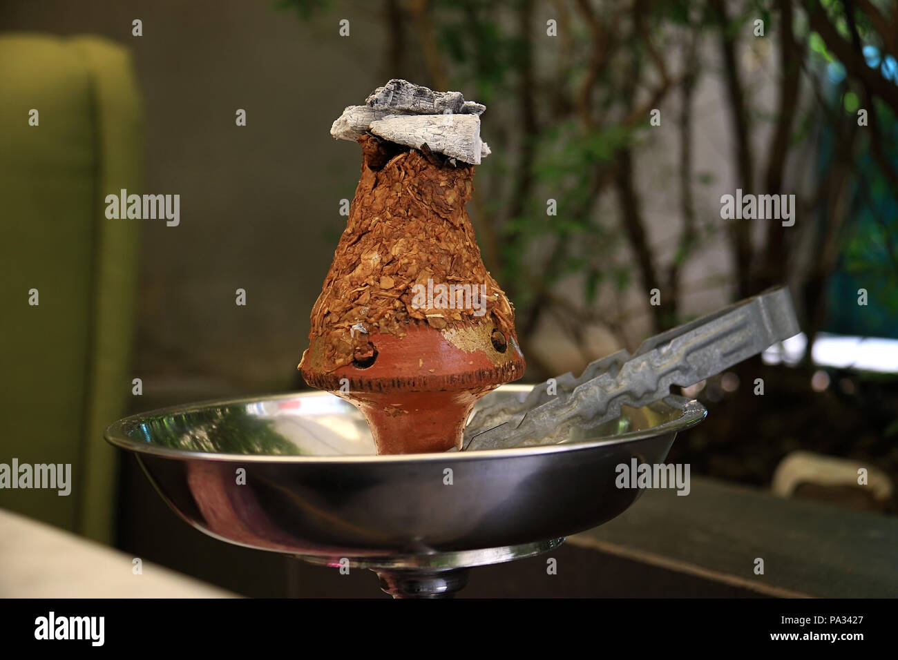 Ajami tobacco leaves burning in a hookah head Stock Photo Alamy