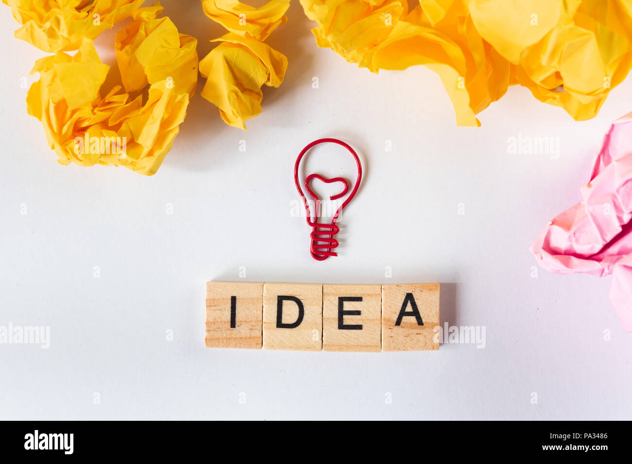 creative idea and innovation concept with light bulb and paper crumbled ...
