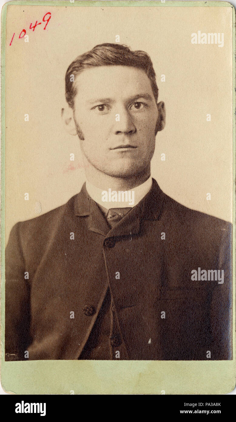 . Mug shot of Eddie Guerin, head-and-shoulders portrait, marked '1049'. Eddie Guerin, 80, Irish-born international crook, bank robber and purse-snatcher; [died] in poverty, at Bury, Lancashire, England. Celebrated for his criminal exploits in collaboration with the legendary 'Chicago May' Churchill, who helped him stick up the American Express office in Paris, Guerin made a sensational escape from Devil's Island in 1905, only to find, when he reached London, that 'Chicago May' had deserted him for a new lover. — TIME, 16 December 1940. circa 1900 605 Eddie Guerin, mug shot, ca. 1900 Stock Photo