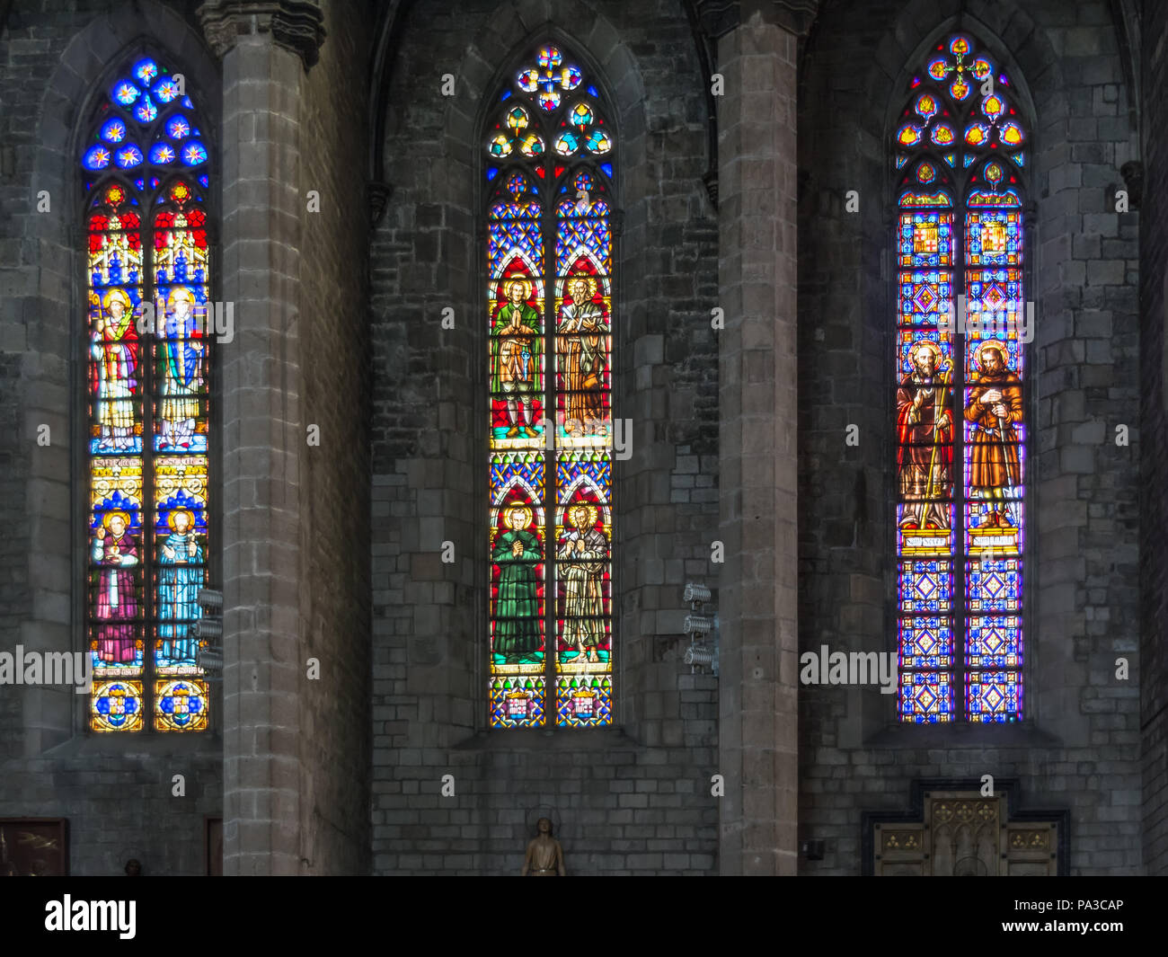 Three colourful stained-glass windows of the gothic Santa Maria del Mar church in Barcelona, also known as the 'cathedral of La Ribera' Stock Photo
