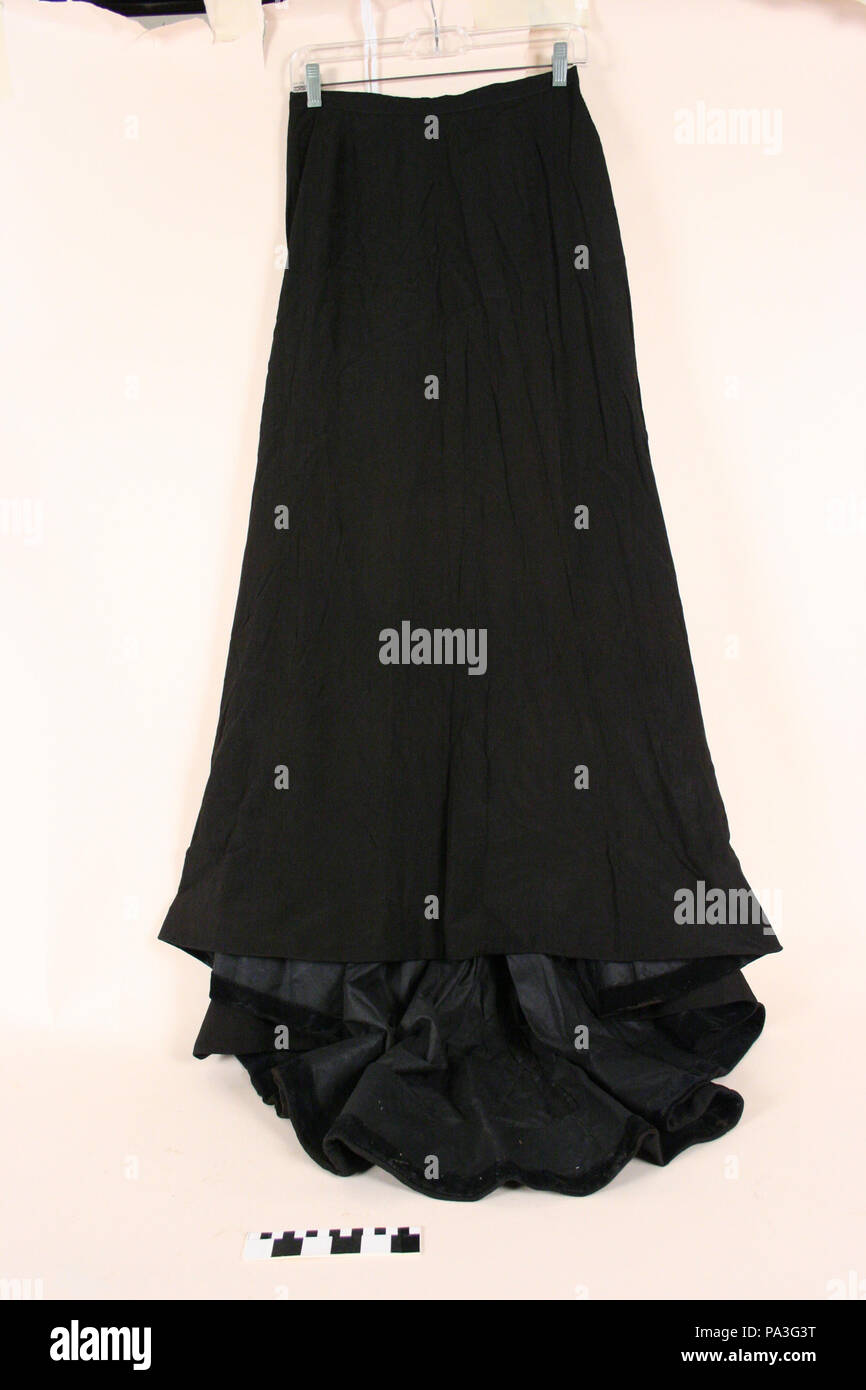 . English: Black silk skirt Title: Black Silk Skirt . between 1880 209 Black Silk Skirt Stock Photo