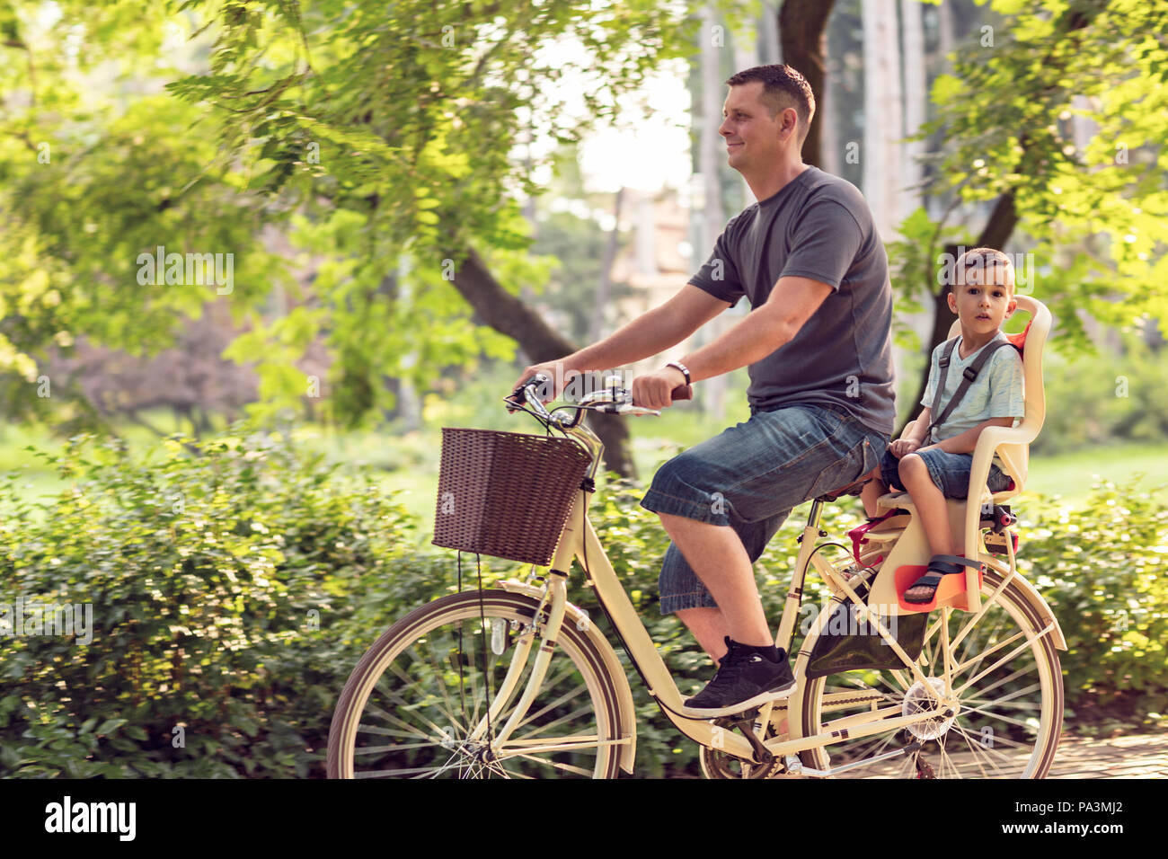 Happy Little Boy Riding a Bike Stock Image - Image of lifestyle