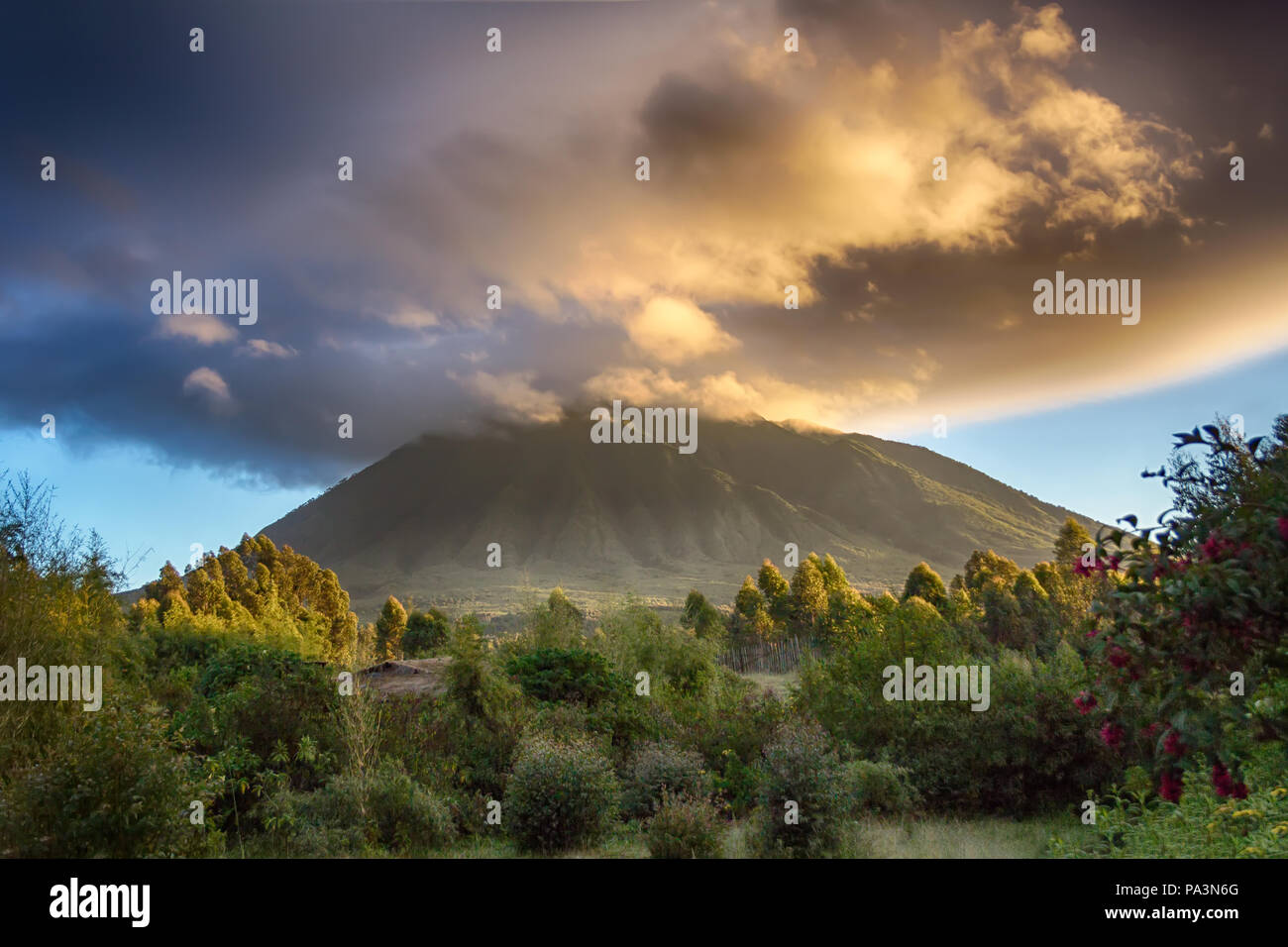 Mount Sabyinyo, an extinct volcano in the Virunga Mountains.  The summit marks the intersection of the border of Rwanda, Uganda and DRC Stock Photo