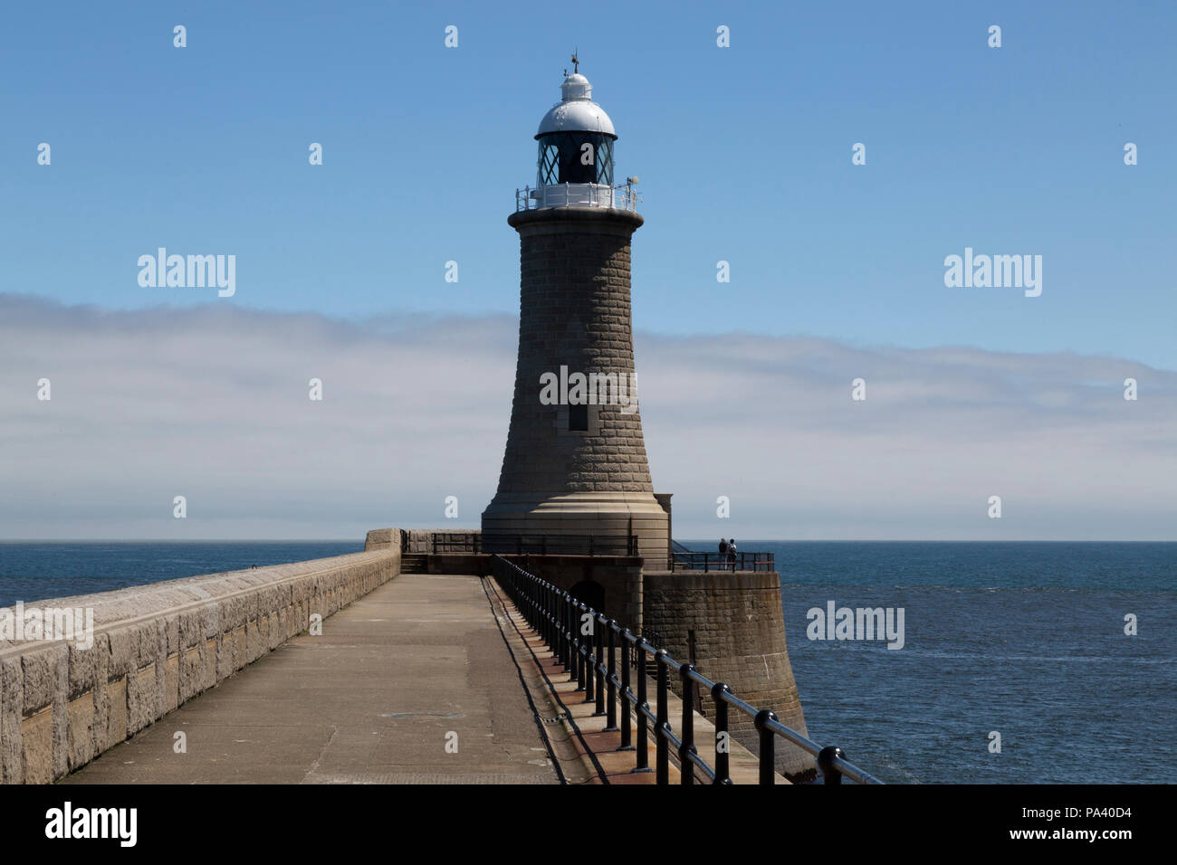 Tynemouth Lighthouse at Tynemouth in England. The lighthouse stands on the North Pier that was designed by John Wolfe-Barry and reconstructed in 1909. Stock Photo