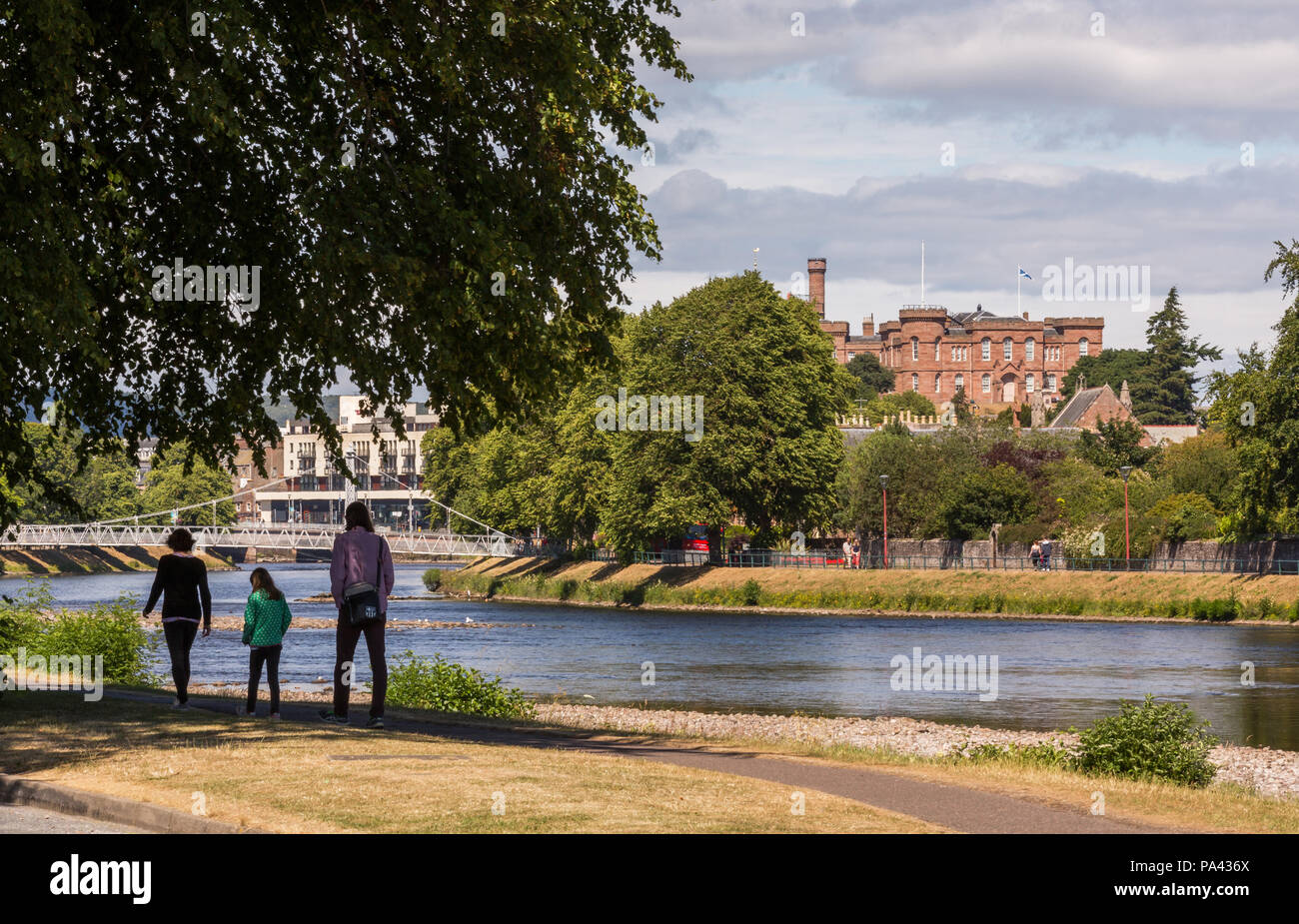 People walking on the path beside the River Ness in the city of Inverness, Scotland, UK Stock Photo