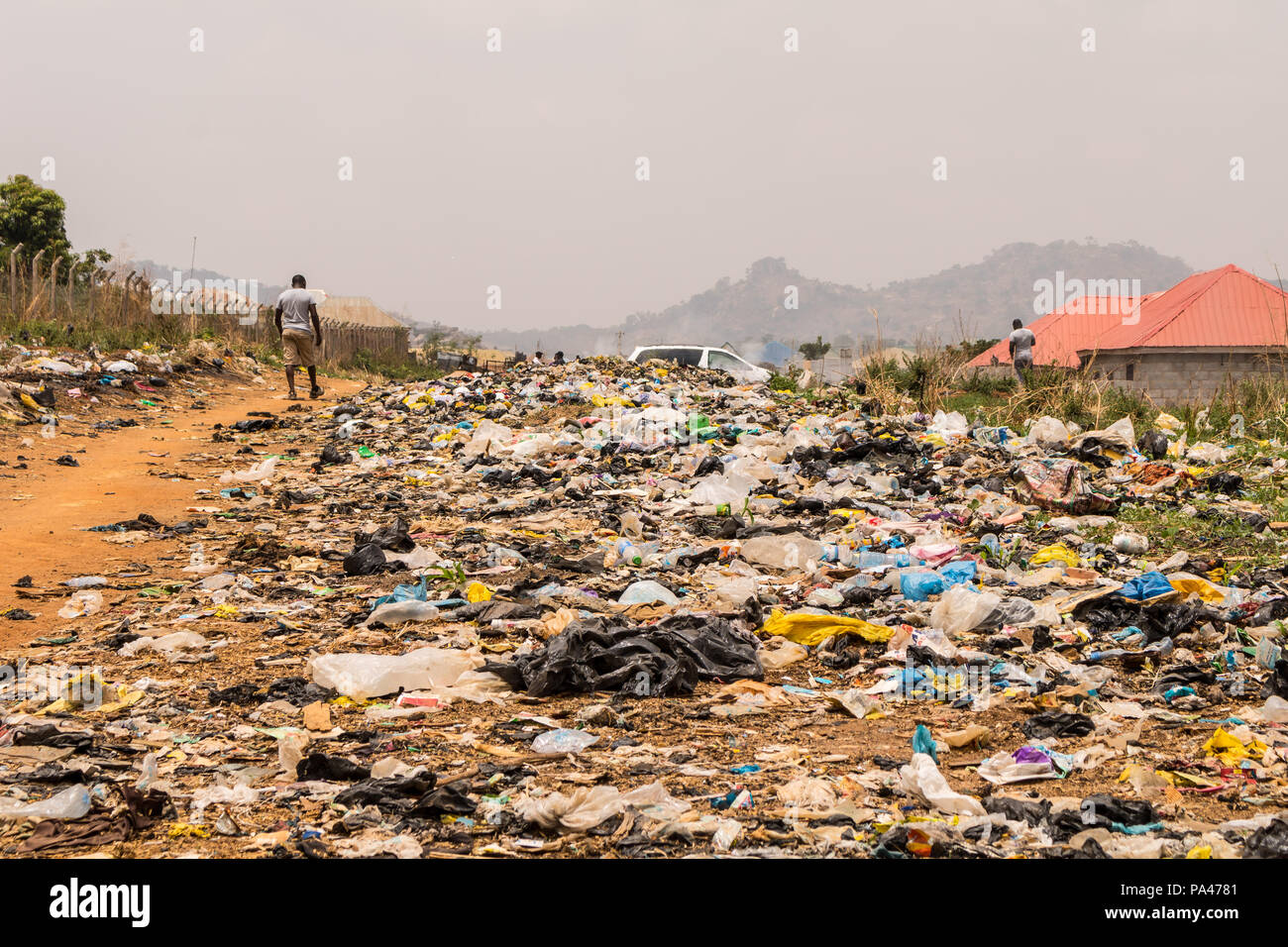 A pile of rubber bags wasteland causing pollution in the city Stock Photo