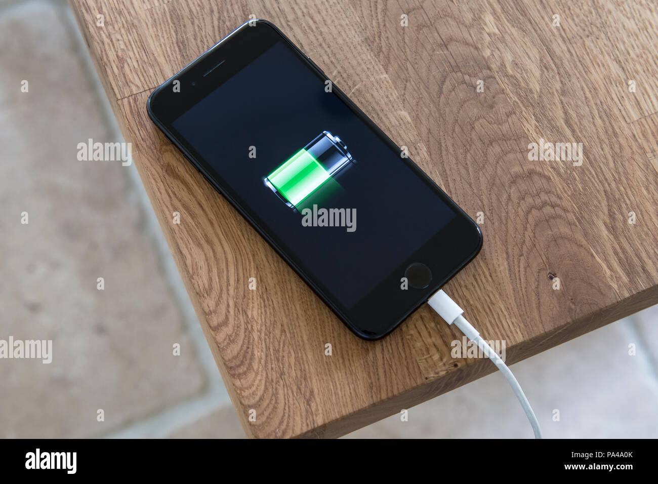 Mobile phone being charged up Stock Photo Alamy