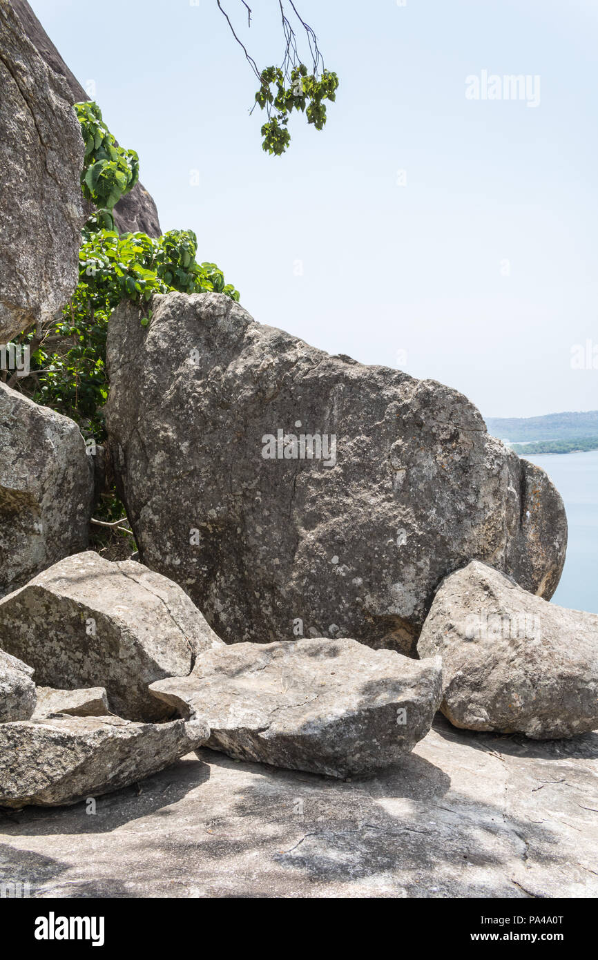 A beautiful and picturesque view of mountains, sky, lush green rainforest and large body of water Stock Photo