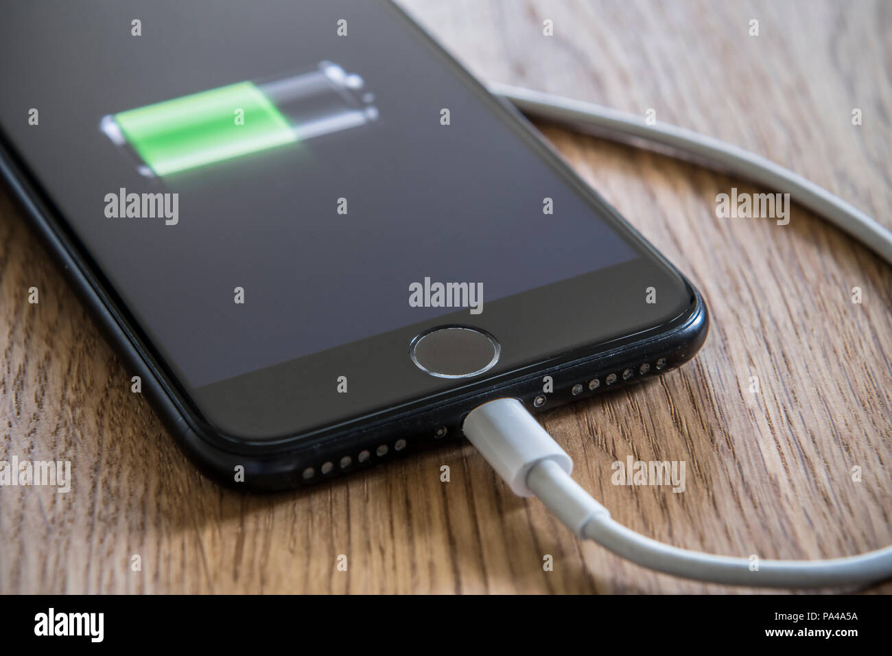 Cell phone being charged up Stock Photo
