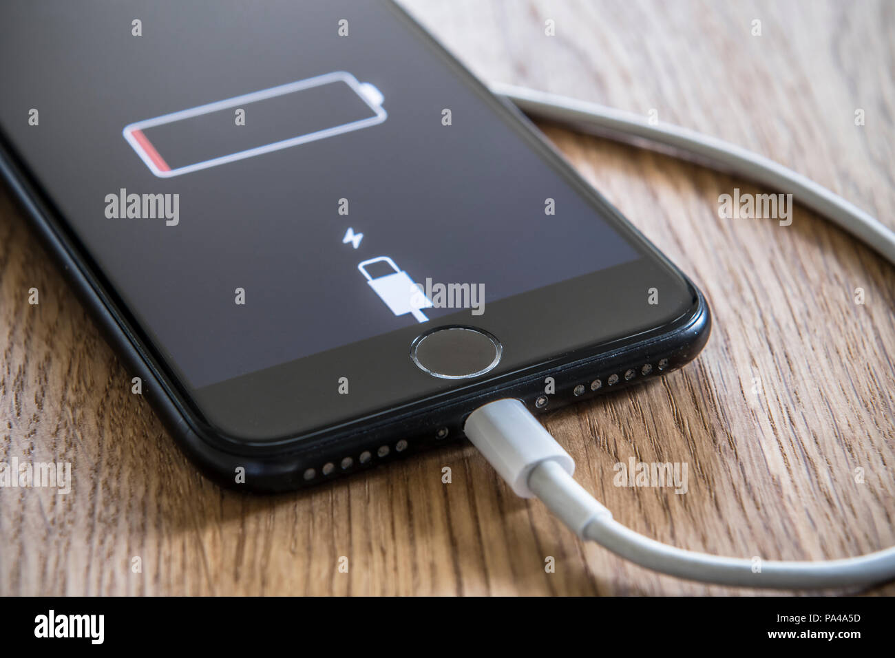 Mobile phone being charged up Stock Photo