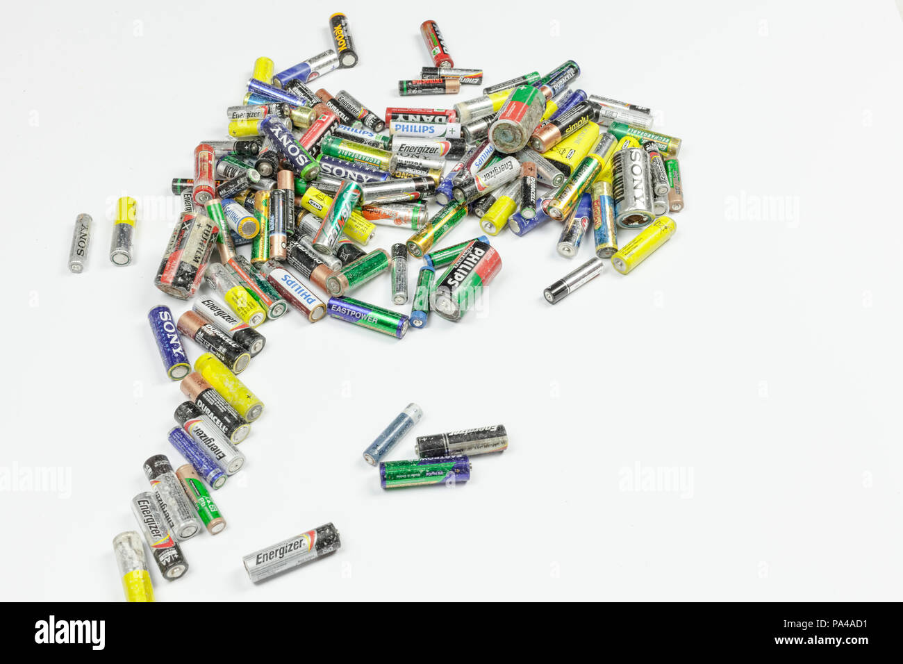 BARI, ITALY - JUNE 9, 2017 - Old used batteries on a white background. Studio shot, editorial use. Stock Photo