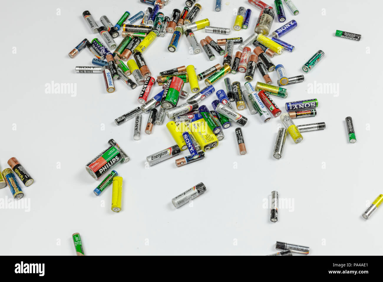 BARI, ITALY - JUNE 9, 2017 - Old batteries on a white background. Studio shot, editorial. Concept: waste, recycling. Stock Photo