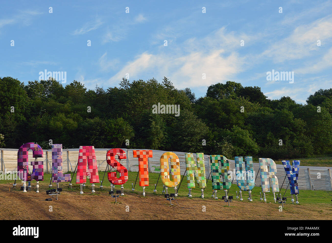 The colourful Glastonbury Festival sign on a summers evening Stock Photo