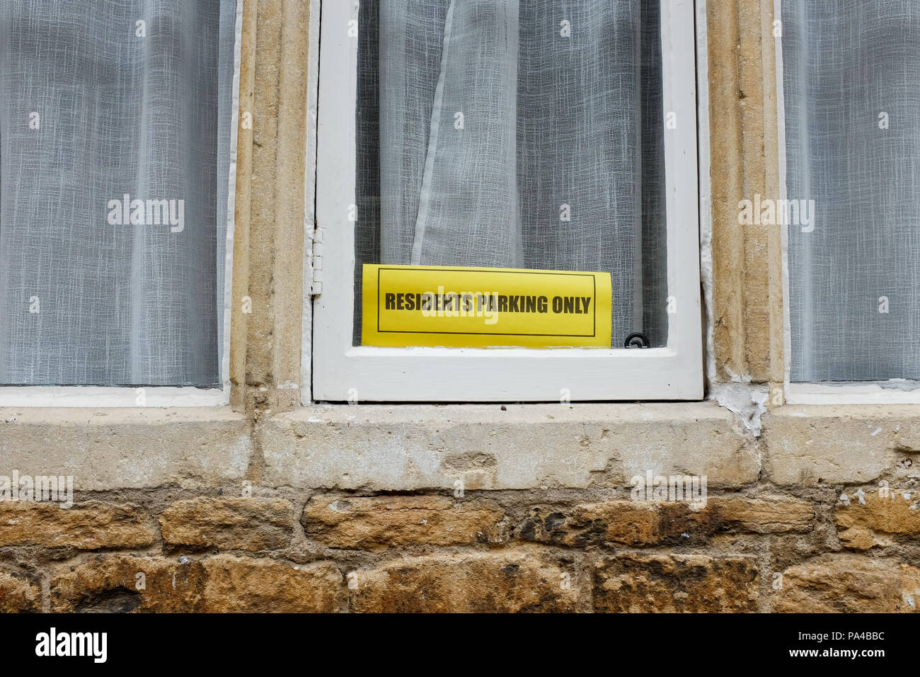 A "residents parking only" sign in the Wiltshire village of Lacock, England. Stock Photo