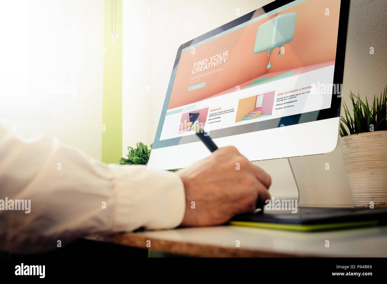 designer learning with tutorials. All screen graphics are made up. Stock Photo