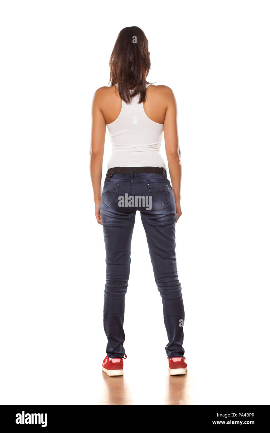 young woman in jeans from behind Stock Photo Alamy
