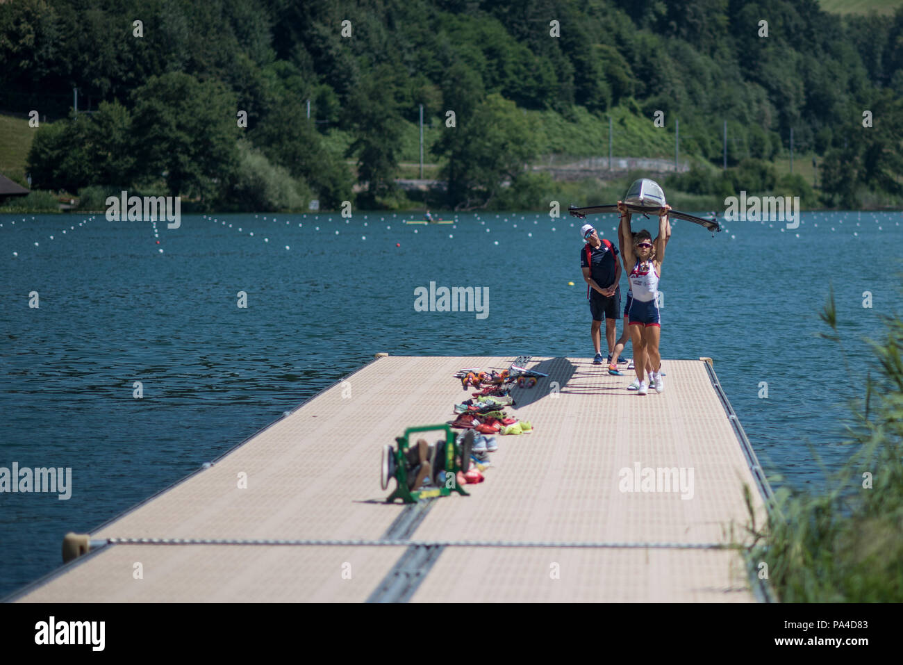 Lucerne, SWITZERLAND, 12th July 2018, Thursday, GBR LW4X Bow,  Madeleine ARLETT,  Elisha LEWIS, Gemma HALL, Francesca RAWLINS and coach, Darren WHITER,  The crew carry their boat from the pontoon after a training session, FISA World Cup III, Lake Rotsee, © Peter SPURRIER, Stock Photo