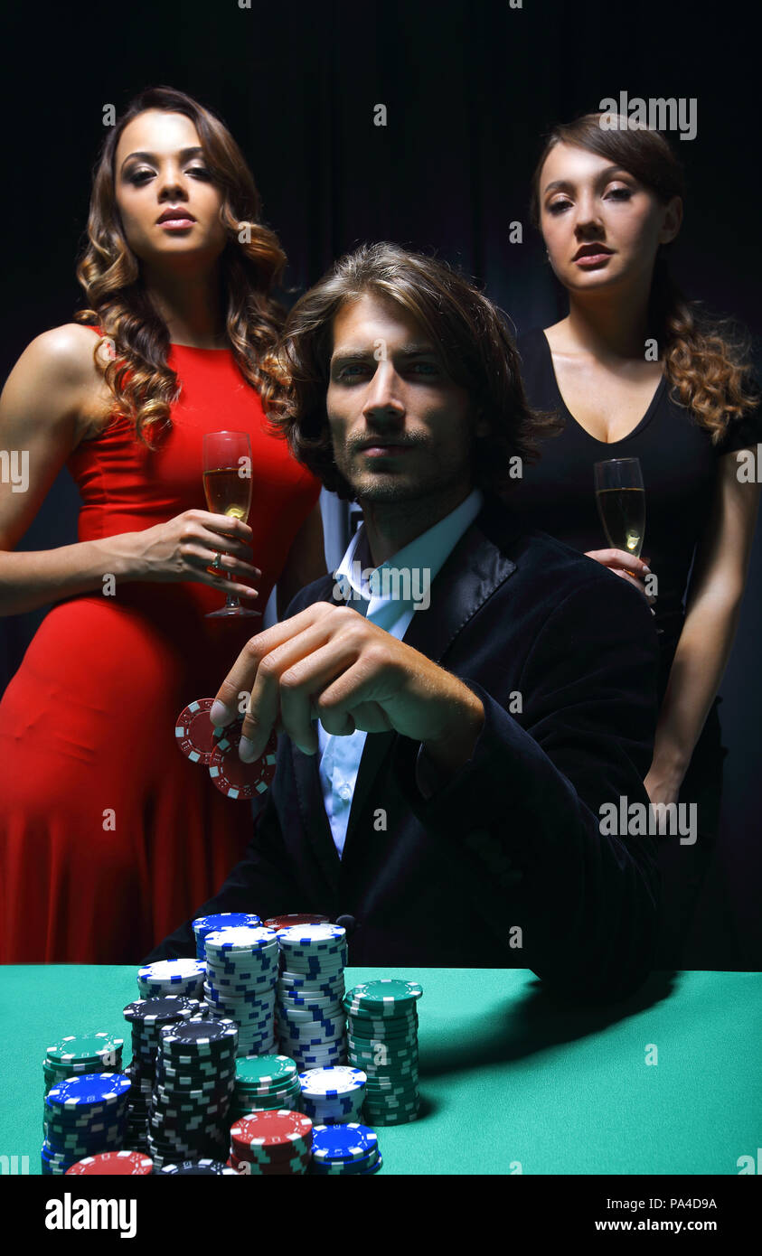 Man at roulette table surrounded by beautiful women Stock Photo - Alamy