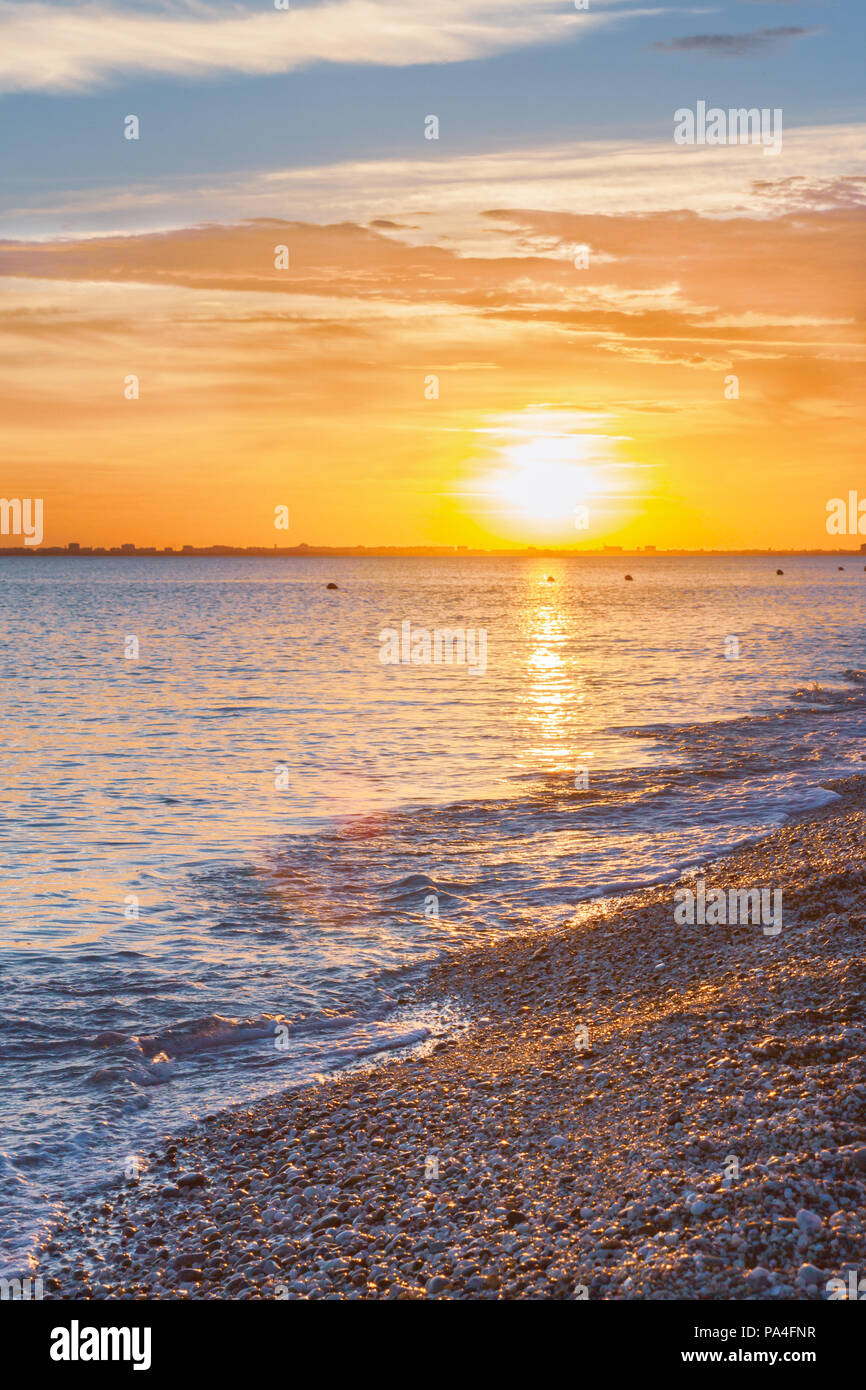 Beautiful summer sunset with clouds over the sea Stock Photo - Alamy